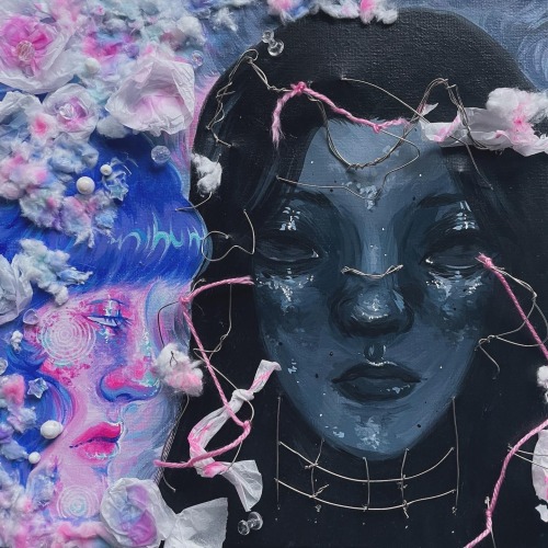 A painting of a two faces. The face on the left is a side-profile of a woman with light pink skin and violet hair. She is surrounded by soft, flower-like forms made of tissue paper and cotton, as well as beads.
					On the right is a woman facing forward. She has grey skin, black hair, and black eyes with no iris. Metal wire protrudes in and out of the canvas on her face. Bits of yarn and tissue paper are tied to the wire.